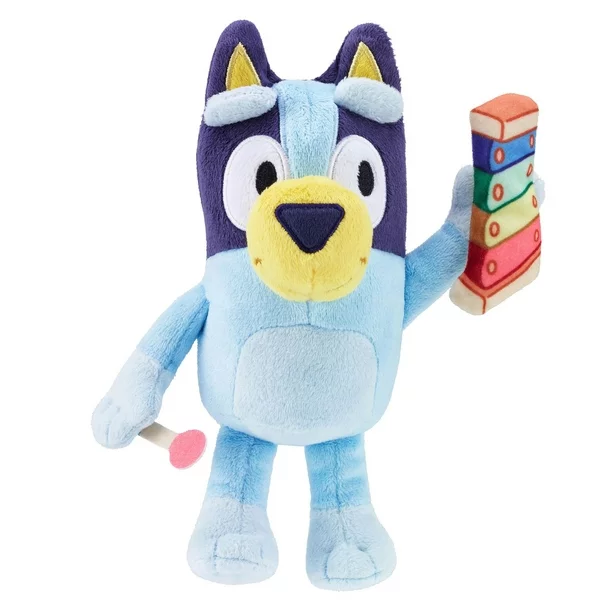 Plush toy character named Bluey from the popular bluey brand who is a blue heeler female dog and holding a xylophone.