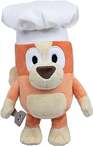 Plush toy character named Bingo from the popular bluey brand who is a red heeler female dog wearing a chef costume.